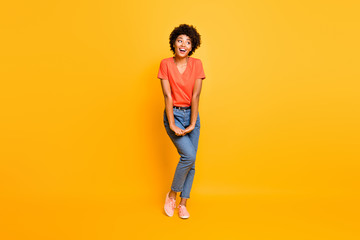 Fototapeta na wymiar Full length body size photo of cheerful cute charming fascinating gorgeous black girlfriend wearing jeans denim t-shirt isolated over yellow vivid color background