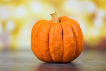 Autumn table setting with pumpkins holiday - Thanksgiving background decoration festive or halloween bokeh background