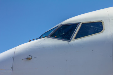 white airplane  cockpit with blue sky