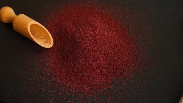 Sumac aromatic spice, sprinkle on the table (delicious food supplement) menu concept. food background. copy space. Top view