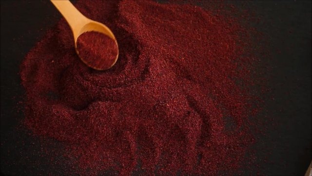 Sumac aromatic spice, sprinkle on the table (delicious food supplement) menu concept. food background. copy space. Top view