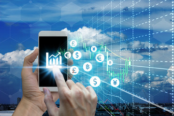 Businessman touch samrtphone network using currency icon technology with virtual screen icons, Investment Financial Technology