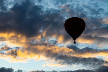 Hot air balloon over blue sky.