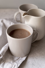 Close-up white cups of delicious coffee