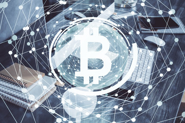 Double exposure of blockchain and crypto economy theme hologram and table with computer background. Concept of bitcoin cryptocurrency.
