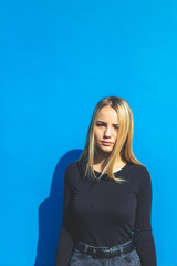 Blonde woman on summer blue background
