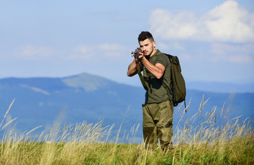 veterans day. muscular man hold weapon. purpose and success. military style. male in camouflage....