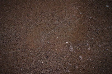 sea ​​water washes sand on the shore, top view
