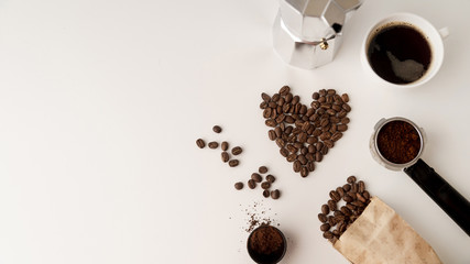 Assortment of coffee beans on white surface