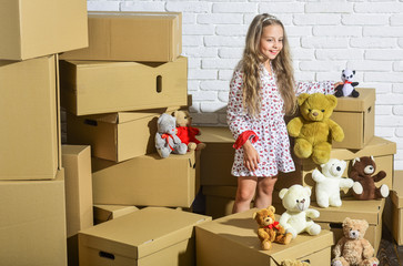Cool apartments. happy child cardboard box. purchase of new habitation. happy little girl with toy....