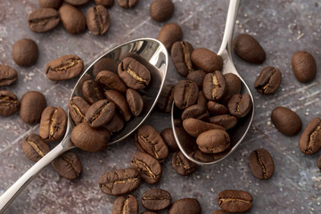 Top view coffee beans in spoons