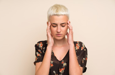 Young woman over isolated wall unhappy and frustrated with something. Negative facial expression