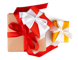 Three beautiful wrapped gifts isolated on white background