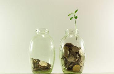 Fototapeta na wymiar saving money concept of collecting coins (money thai bath in glass bottles)