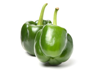 fresh green bell pepper (capsicum) on a white background