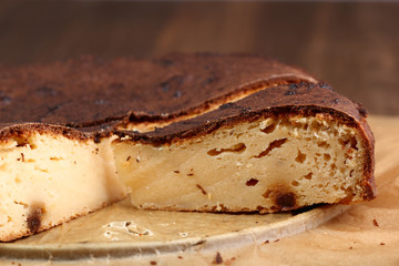 Slicing Cheesecake with raisins - freshly baked