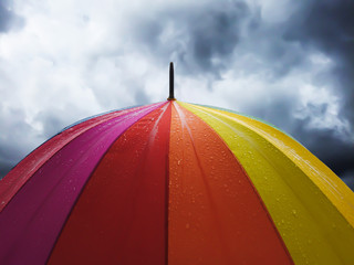 colorful umbrella on a background of blue sky