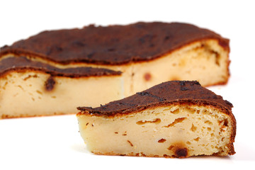 Cheesecake with raisins. Isolated on a white background.