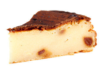 Slice of Cheesecake with raisins. Isolated on a white background