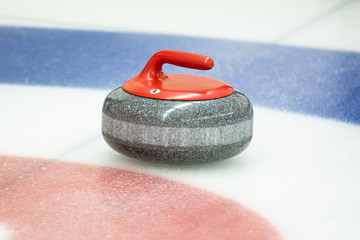 Curling rock on the ice - obrazy, fototapety, plakaty