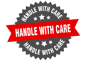 Obraz premium handle with care sign. handle with care red-black circular band label