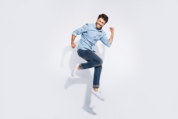 Full size profile photo of funny indian guy jumping high rejoicing raising fists crazy competitive...