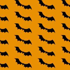 Halloween pattern. Black silhouettes of bats on a orange background. Seamless vector backdrop