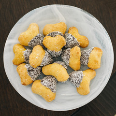 plate of sweet salted cookies on wooden floor.