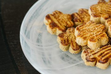 plate of sweet salted cookies on wooden floor.