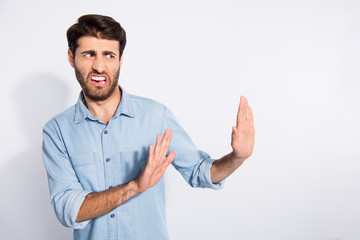 Photo of amazing multiethnic guy looking empty space with disgust stop with arms movement to him...