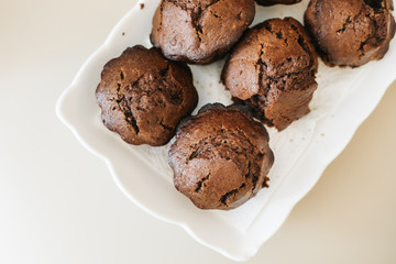 Chocolate homemade cupcakes muffins. in white plate