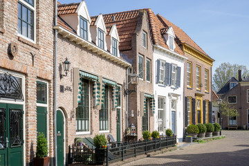 Street view of the historical houses at the 'Smeepoortenbrink' (is the streetname) in the city of...