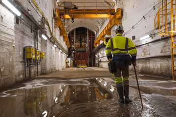 Miner walking towards the shaft and exit cage