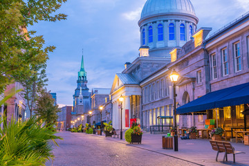 Old town Montreal at famous Cobbled streets at twilight - obrazy, fototapety, plakaty
