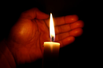 Hand and candle