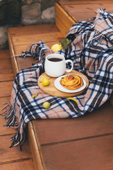 Autumn picnic with hot tea and cinnabon.