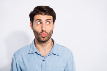 Photo of amazing arab macho guy looking empty space sending air kiss wondered if it was received wear casual denim shirt isolated white color background