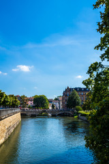 Germany, Beautiful view over neckar river and flower decorated bridge of old town esslingen am...