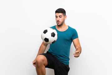 Handsome young football player man over isolated white wall