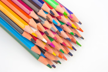 Colored pencils for drawing on a white background. Education and creativity. Leisure and art