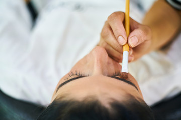 Obraz na płótnie Canvas Process of making makeup in beauty salon