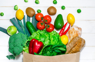 An eco-friendly paper bag with fresh food for a healthy diet.