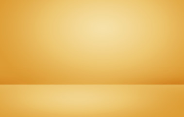Abstract background of gold gradient with soft light glowing backdrop texture for christmas