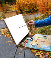 artist with palette and easel