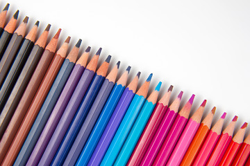 Colored pencils for drawing on a white background. Education and creativity. Leisure and art