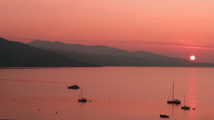Obraz na płótnie Canvas Sunset at the sea and mountain