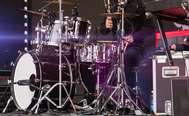 Rock concert. Drummer in action on stage.