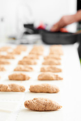 man preparing meat stuffed cannelloni