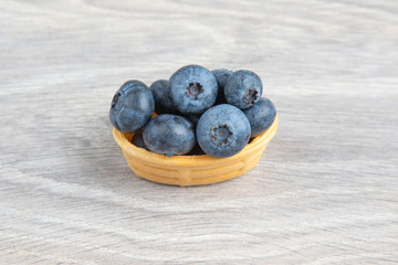 Blueberries in a waffle basket. Vitamins and wholesome foods