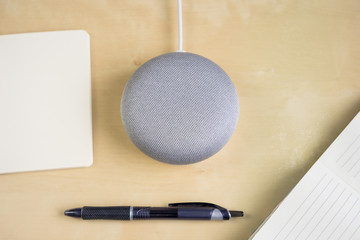 Ai speaker. Smart home device with note pad paper for making notes.